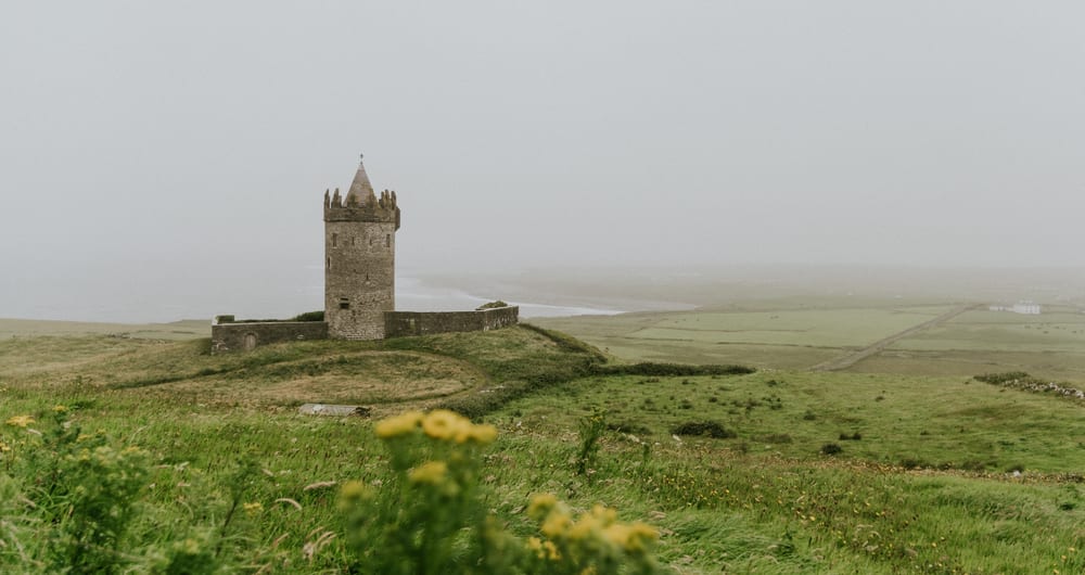 Green fields and castle in Ireland