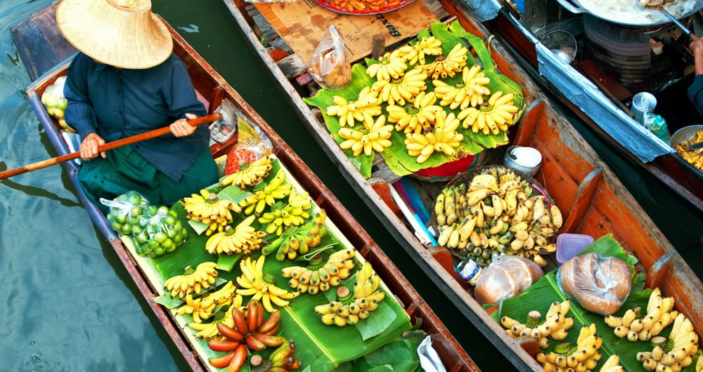 damnoen saduak floating market with vendor in a canal boat in bangkok in thailand