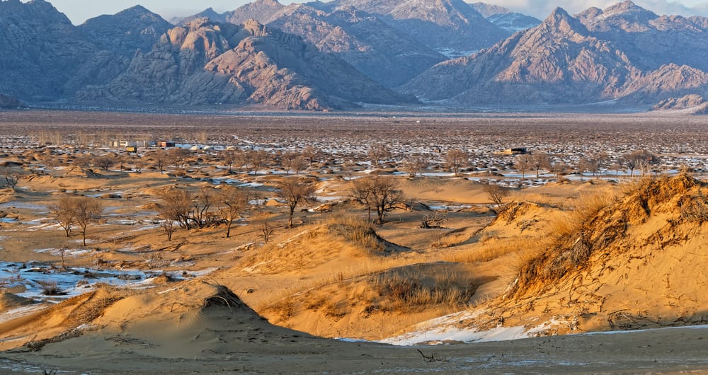 mountains and sand dunes in bayangobi in mongolia