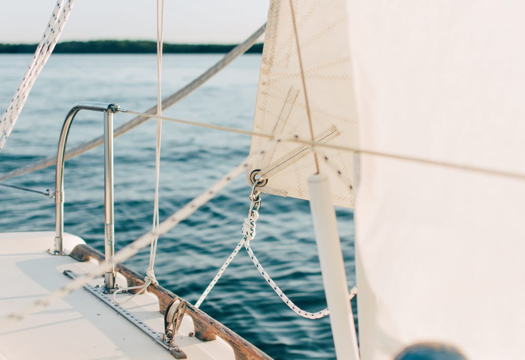 Sailing boat on blue water