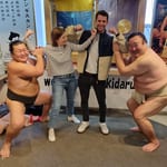 Rob O'Leary in Japan with sumo wrestlers