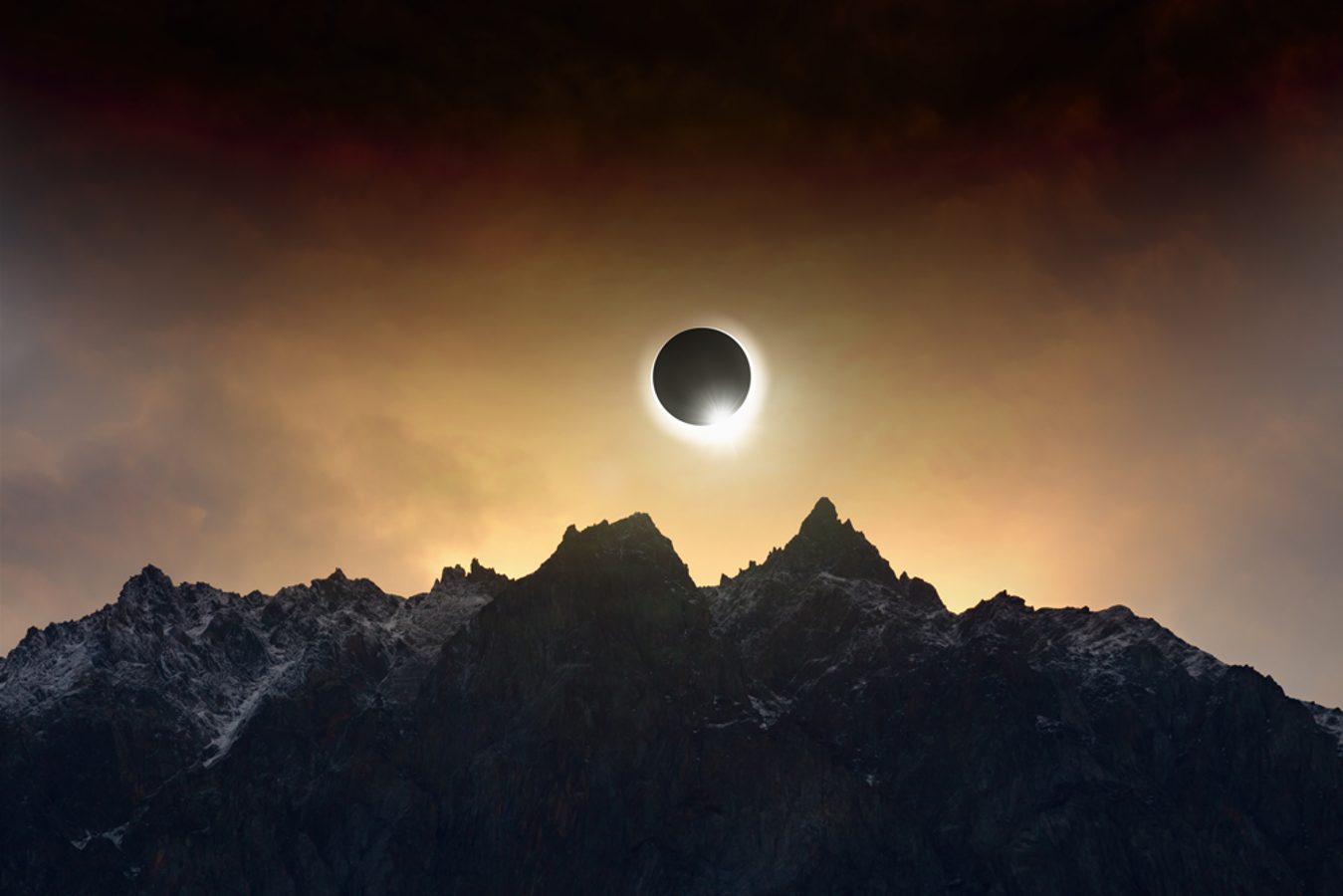 Solar eclipse over the mountains