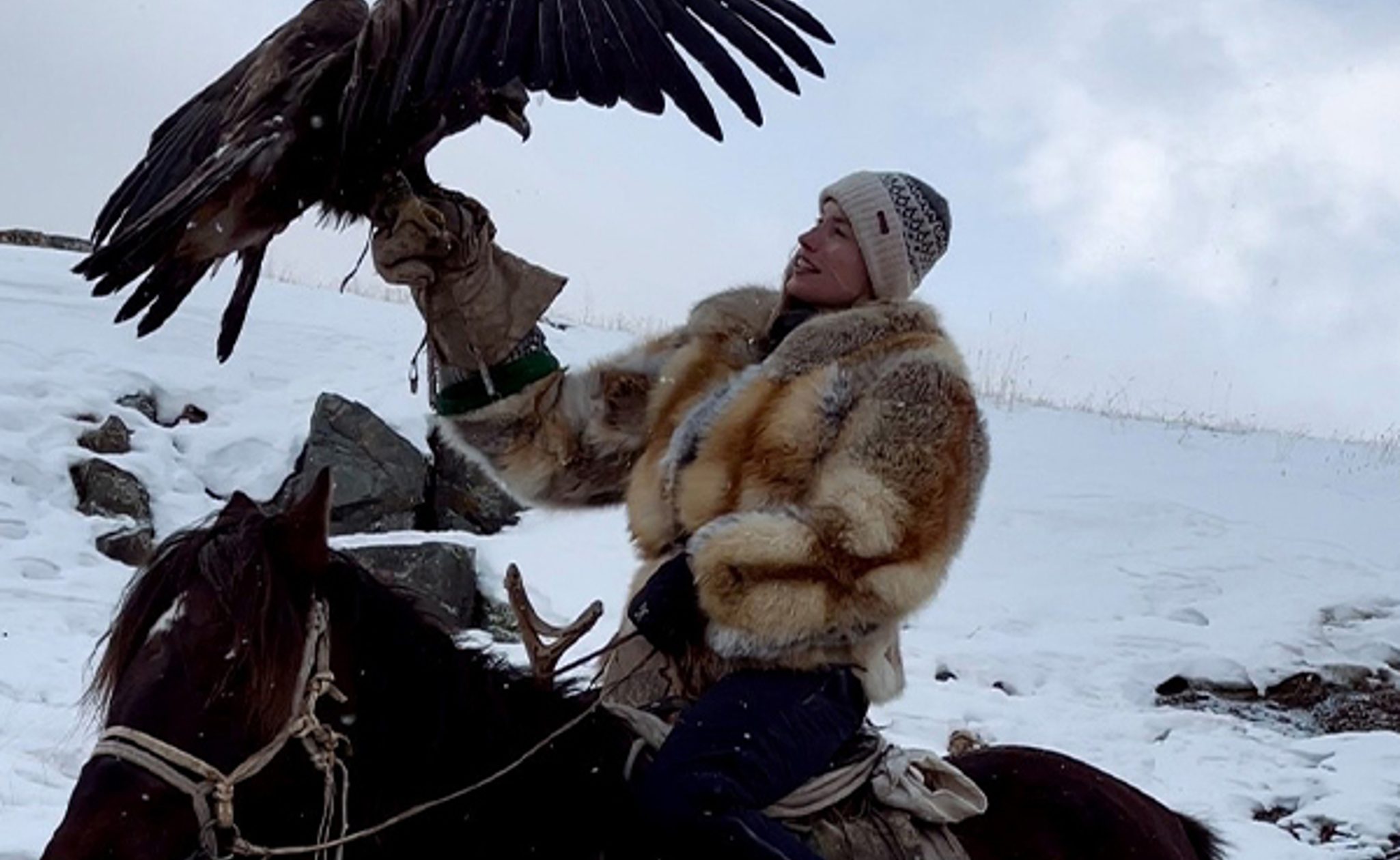 Chloe with eagle, luxury travel Mongolia