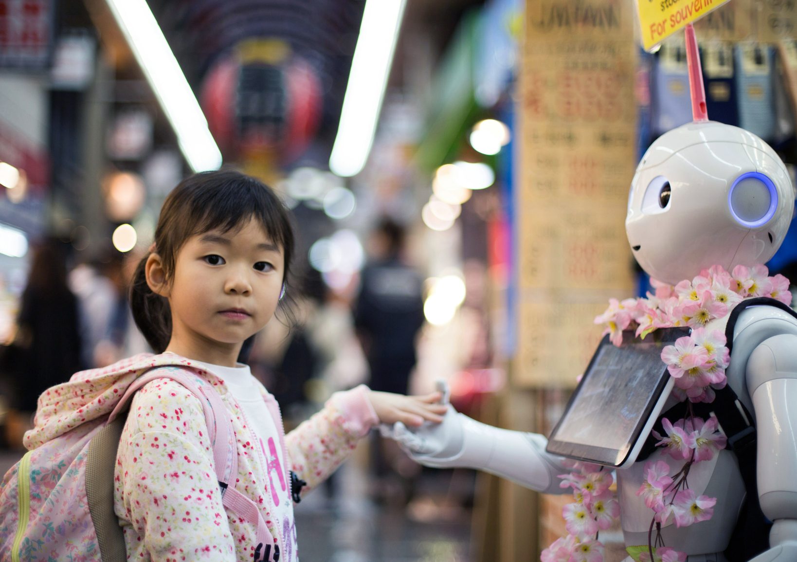 Girl with robot at Kuromon Ichiba Market, Osaka, Japan