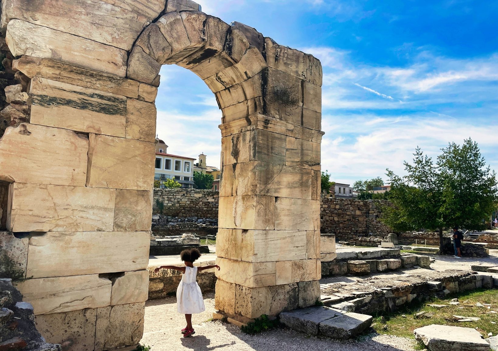 Girl in Athens under archway