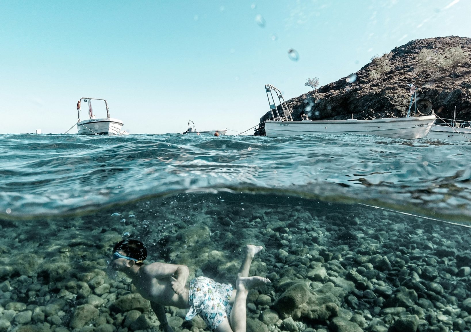 Kid snorkeling in Crete, Greece