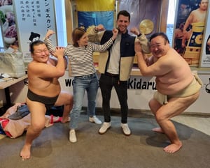 Rob O'Leary in Japan with sumo wrestlers