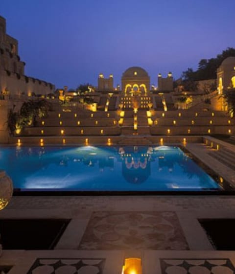 Stunning pool areas lit up at night at Amarvilla, Agra, India