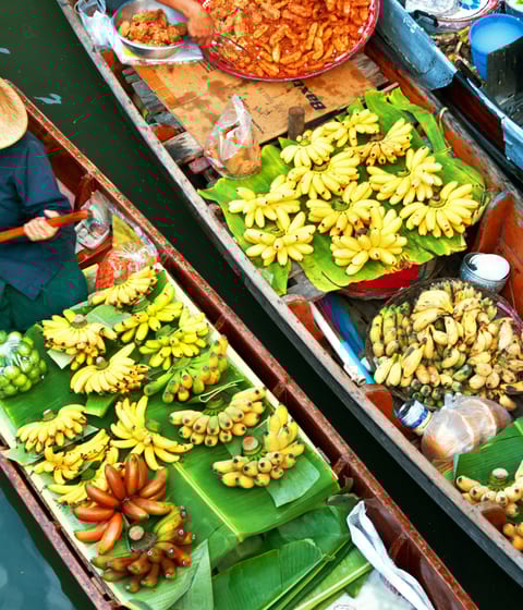 damnoen saduak floating market with vendor in a canal boat in bangkok in thailand