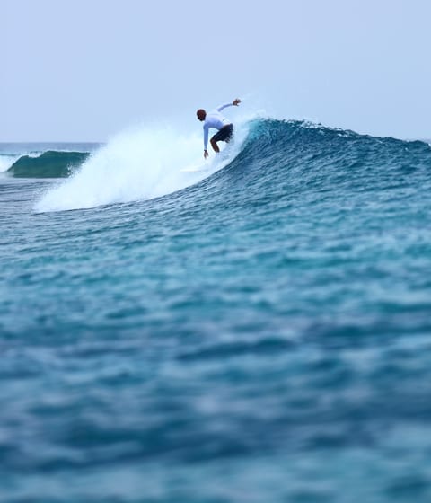 surfing at Gili Lankanfushi in the maldives