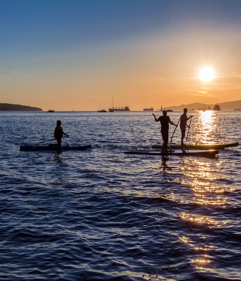paddleboarding at sunset in miyako island in okinawa in japani