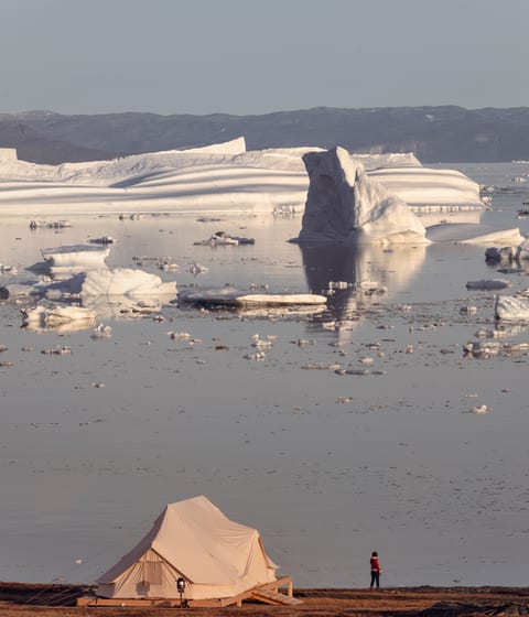 sunrise at saqqaq camp in disko bay in greenland