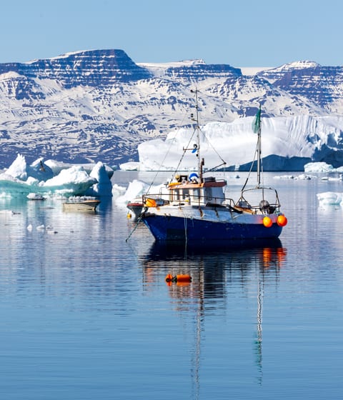 saqqaq village fishing boat in disko bay in greenland