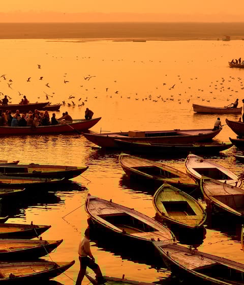 boats on the ganges river in varanasi in india