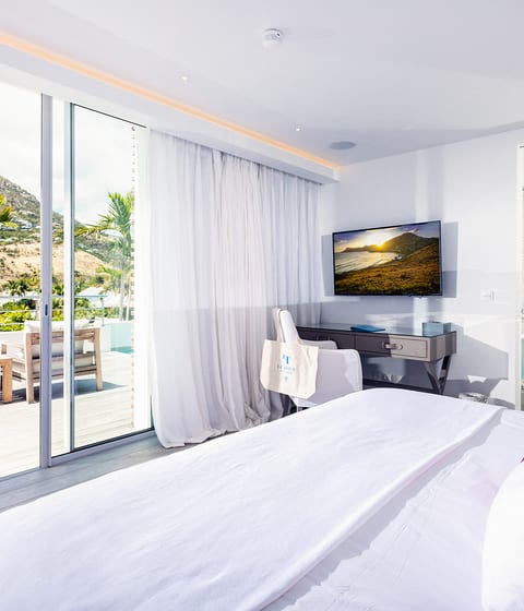 Vaulted ceilings, light wood floors, and the Atlantic through the glass