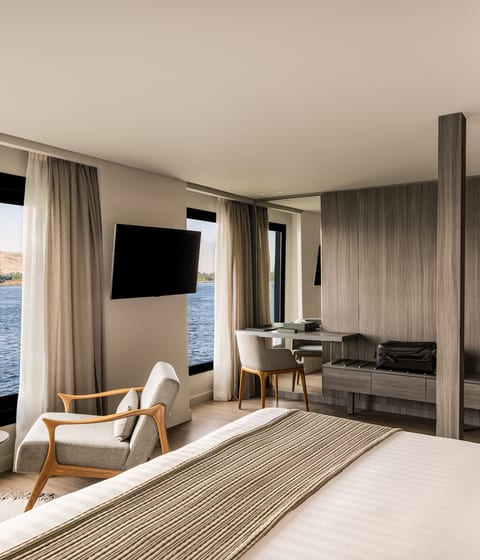 Wake up to the Nile outside your window, ancient riverbanks drifting slowly past