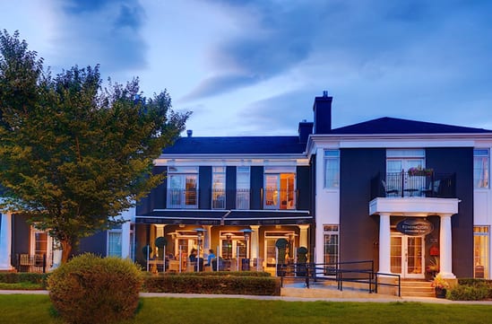 The grand exterior of the Kensington Riverside Inn