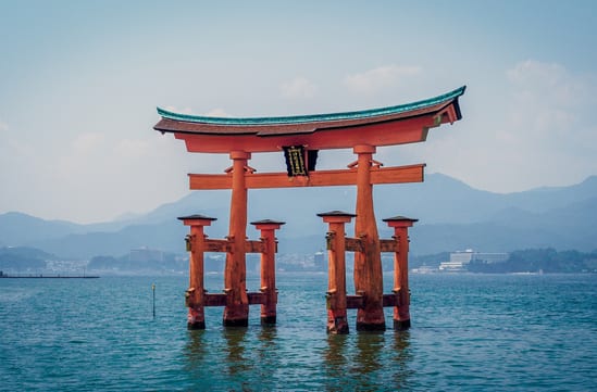 Red arches over water in Japan