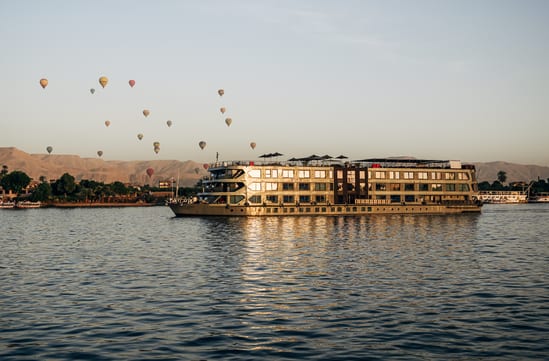 Historia on the Nile, with Luxor's morning balloons rising above