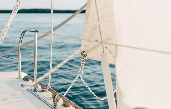 Sailing boat on blue water