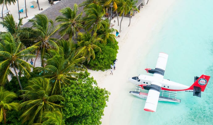 Arrive by plane to the Maldives