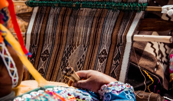 A cotton weaver works in Peru, South America