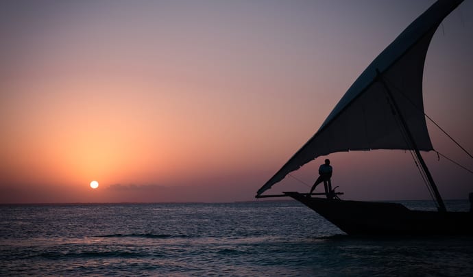 Traditional fishing boat on waters around Dar Es Salaam, Zanzibar, Tanzania
