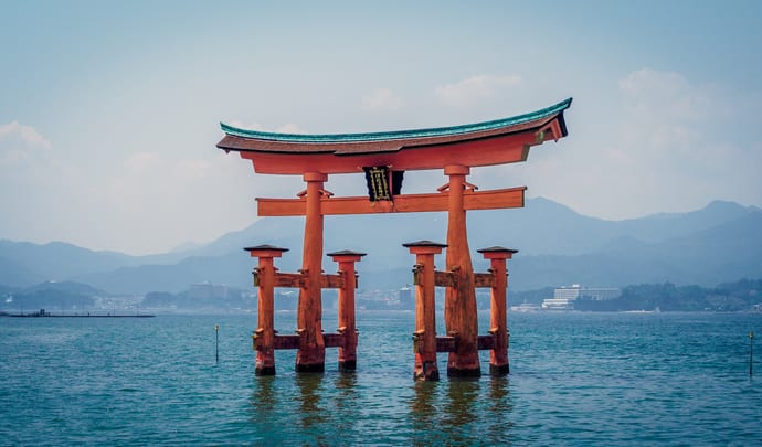 Red arches over water in Japan
