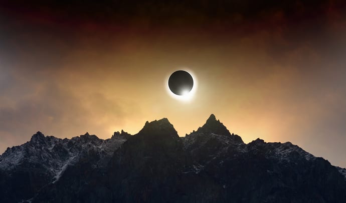 Solar eclipse over the mountains