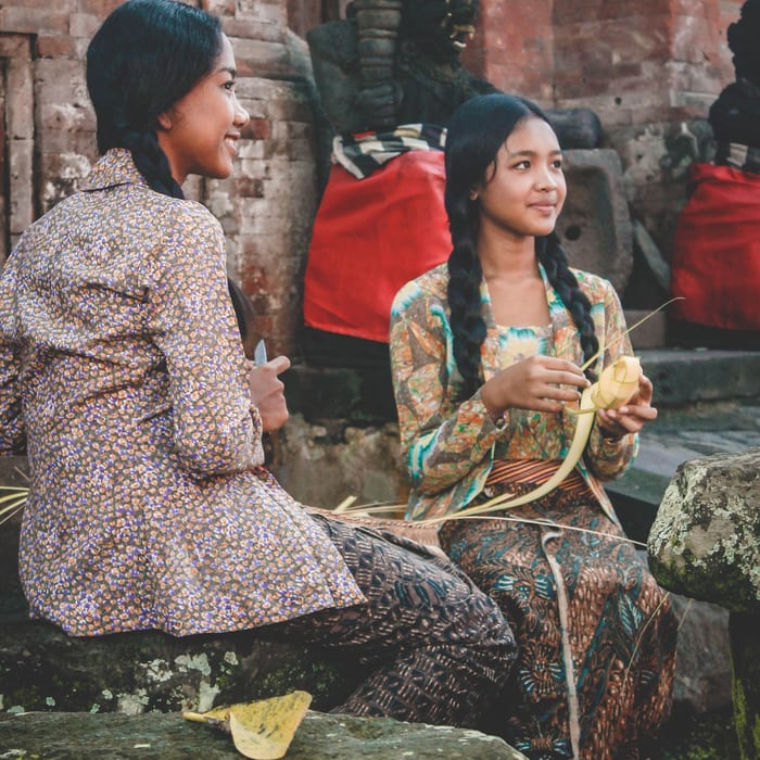 Two ladies weaving in Indonesia