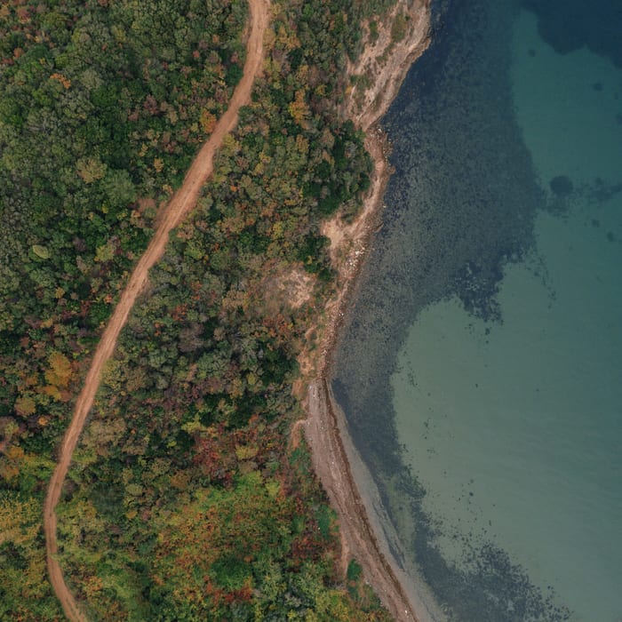 Drone shot of a pathway along the coast