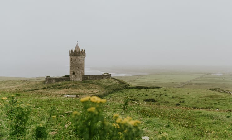 Green fields and castle in Ireland