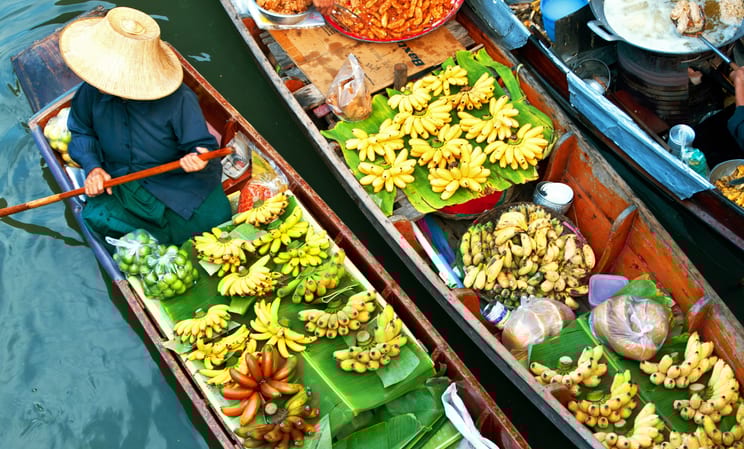 damnoen saduak floating market with vendor in a canal boat in bangkok in thailand