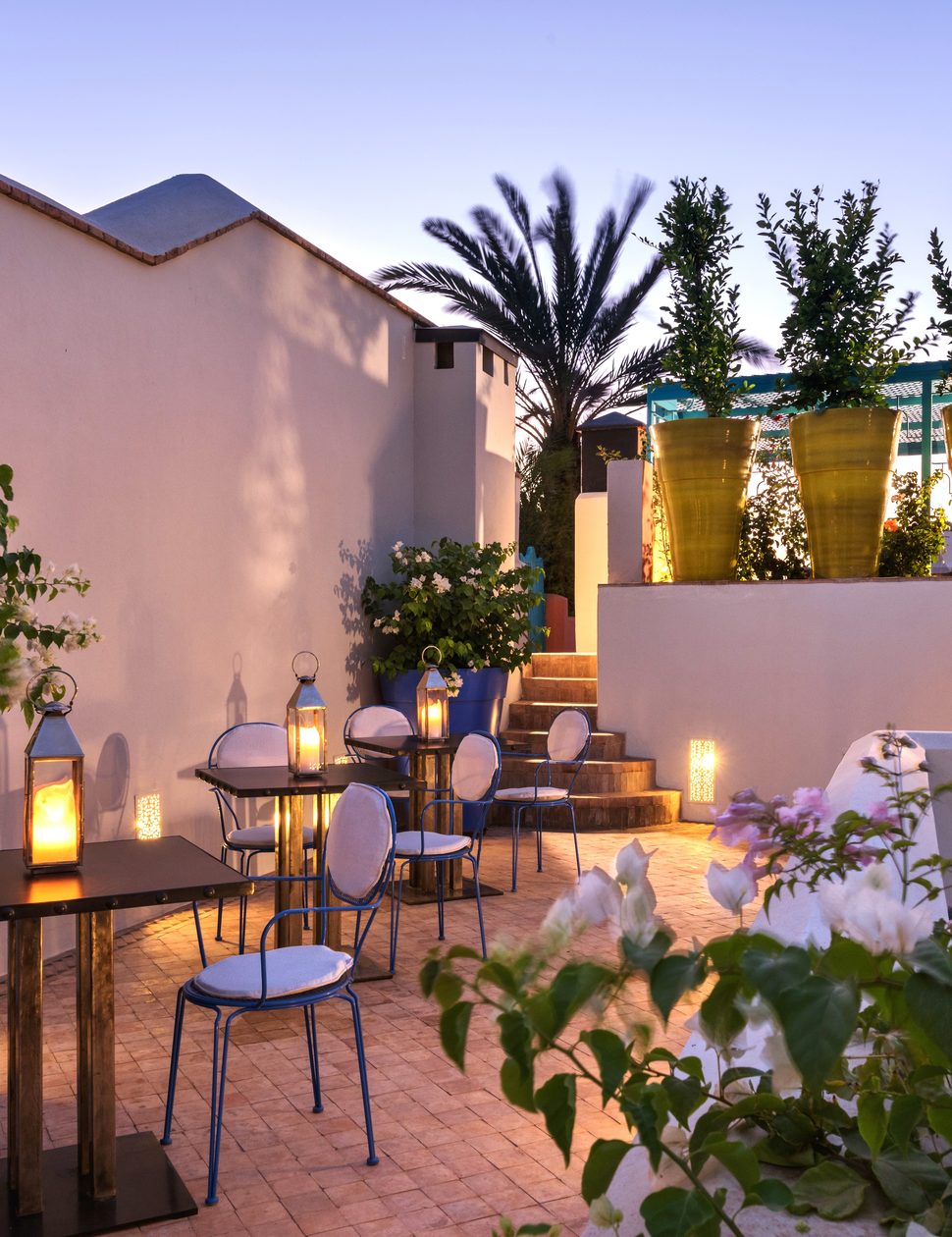 riad farnatchi hotel evening terrace roof sunset dinner gourmet lantern traditional dining in morocco