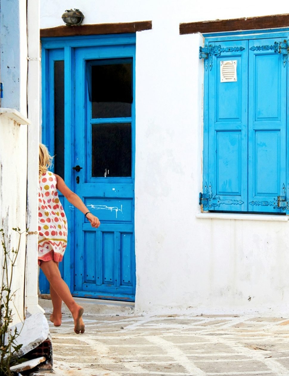 Girl running through street in Antiparos