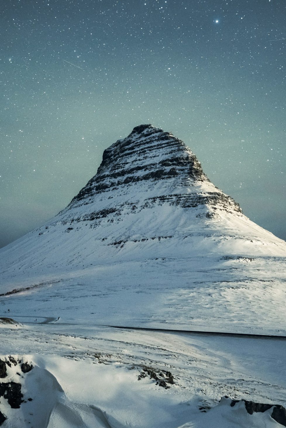 Iceland's winter landscapes with starry sky above