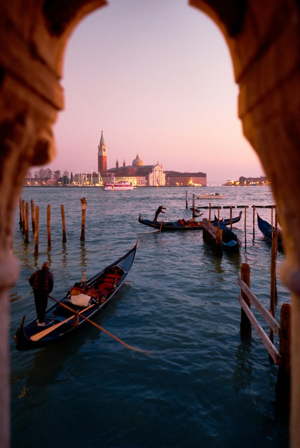 Venice at sunset with gondolas