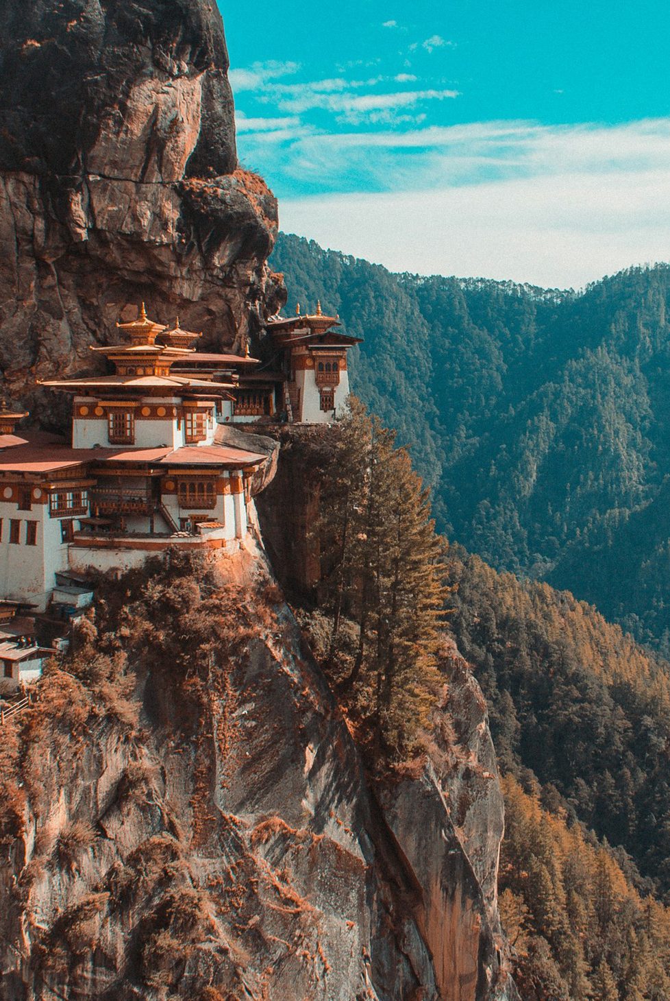 A pagoda on the side of a cliff in Bhutan