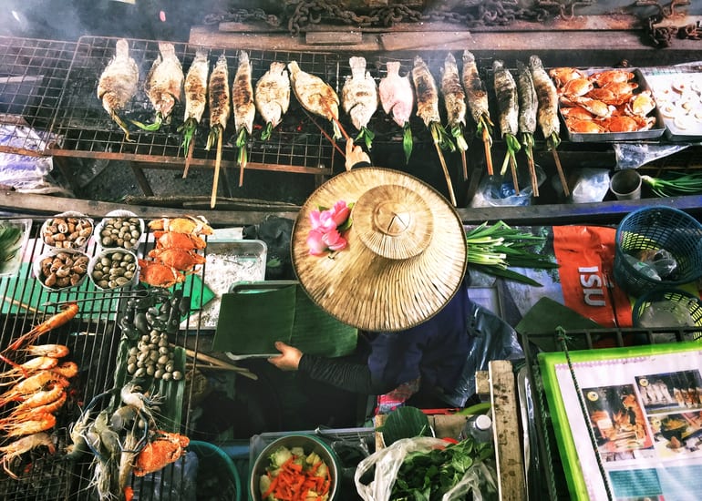 bangkok market street food vendor in thailand