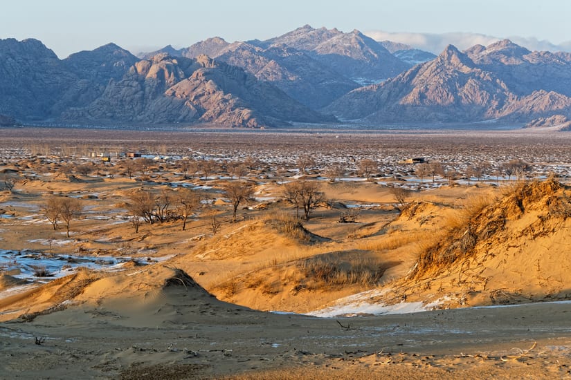 mountains and sand dunes in bayangobi in mongolia