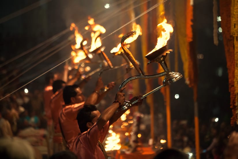 priests praying in varanasi in india